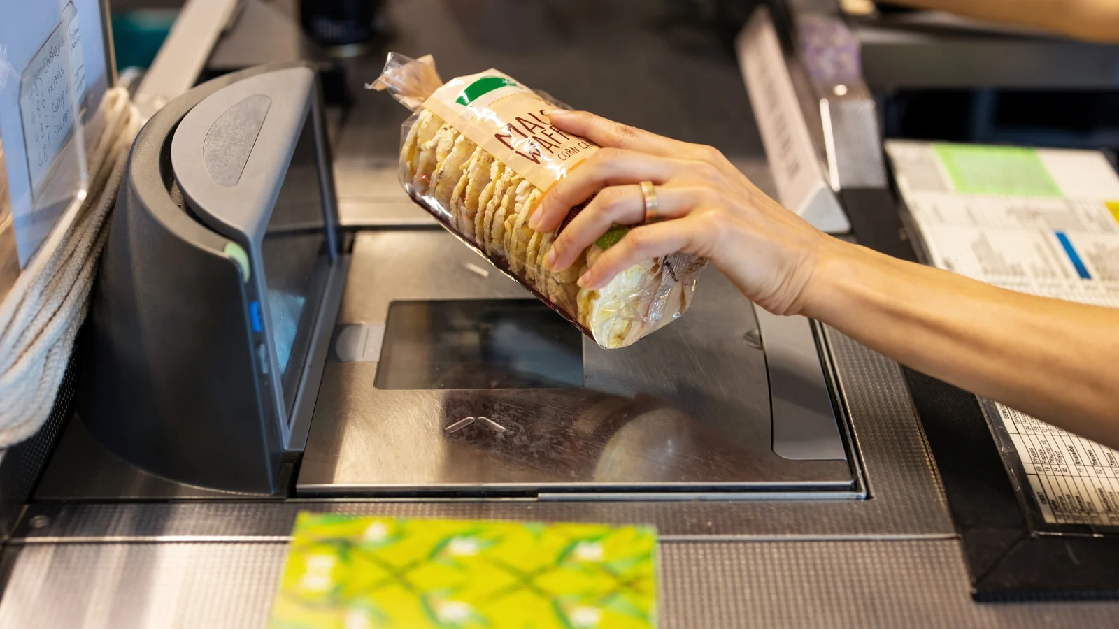 A speaker addressing a seated crowd in an auditorium